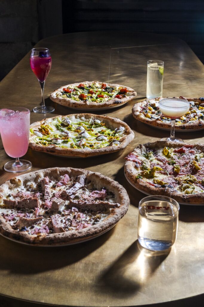 Pizze del DryMilano che compie 13 anni